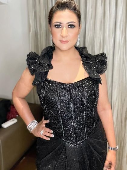 A direct look at the glittery black smokey eye, perfect for a glamorous reception or cocktail party.