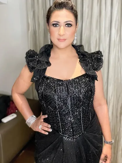 A confident pose that showcases the power of a great smokey eye. This makeup is designed for turning heads and owning the night.