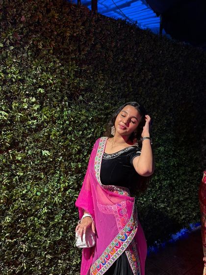 A close-up of the black and pink Navratri look. The silver jewellery completes the festive ensemble.