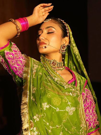 Another artistic shot of the Rajasthani bridal look, highlighting the graceful pose and the beautiful synergy between the makeup, jewelry, and attire.