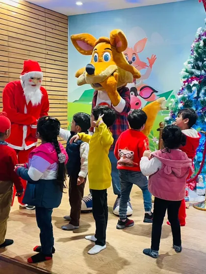 Children gather around Santa for a story and festive fun. Our Christmas celebrations are filled with magical moments.