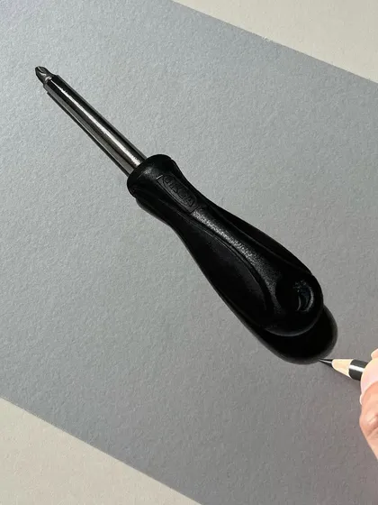 A completed drawing of a screwdriver. I focused on the contrast between the transparent handle and the metallic shaft to create a sense of three-dimensionality.
