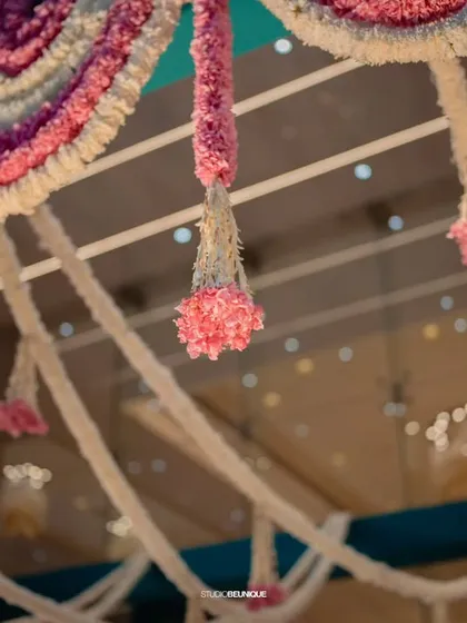 A close-up of the intricate floral hangings, showing the craftsmanship involved in creating these beautiful decor elements.