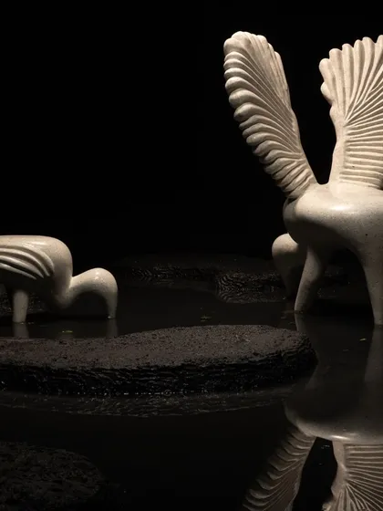 The Pakhru Collection, featuring our swan-inspired chairs. Made from concrete terrazzo with an infusion of mother of pearl, these pieces capture the graceful silhouettes and majestic forms of birds, embodying maximalist sophistication.