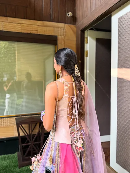 A side angle of the fishtail paranda braid, showing how it moves and flows with the client. It's a practical yet stunning choice for events with lots of dancing and movement.