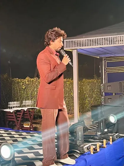 Celebrity host Hussain Kuwajerwala on stage at "The Royals" NYE party. We handle all aspects of event production, including celebrity engagement and entertainment.