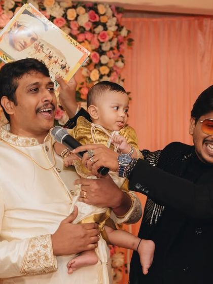 "Laughter is my favorite mic check!" A fun moment with a baby and his father on stage. I love creating these sweet, memorable interactions.