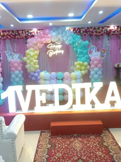 A dreamy Unicorn theme for Vedika's first birthday stage. I used a pastel rainbow balloon arch, unicorn cutouts, and a glowing neon sign to bring this magical world to life. This is one of the most requested themes for little girls.