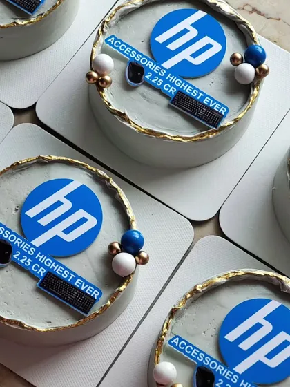 An example of a bulk corporate order of mini cakes for HP. Each cake features the company logo and branding, designed with a clean, elegant aesthetic perfect for celebrating team achievements or corporate events.
