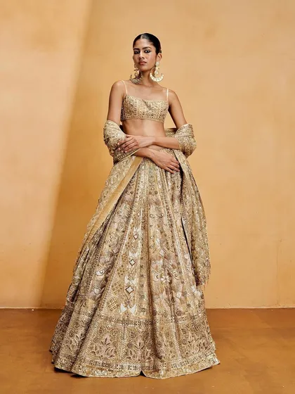 For this Anita Dongre shoot, we created a super clean, snatched bun in the shape of the number "8" to complement the reverse smokey eyeliner.