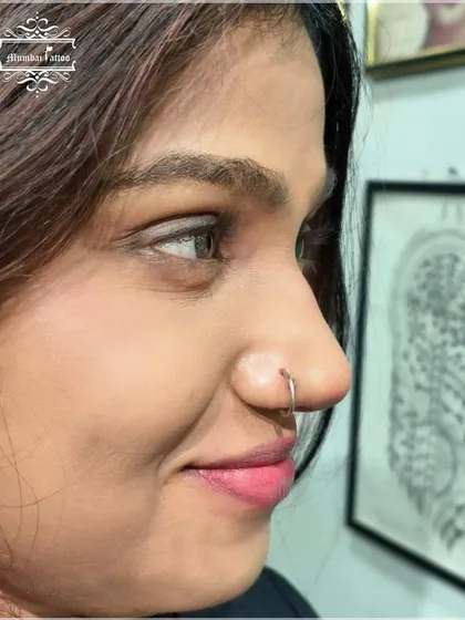 A classic nose hoop adds a touch of timeless style. We can help you choose the right size and material for your new or healed piercing.