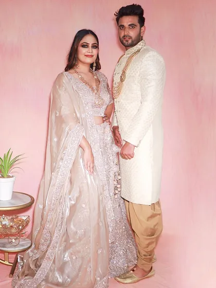 Couples that rent together, save together. This pair looks stunning in their coordinated pastel outfits, perfect for an engagement or reception.