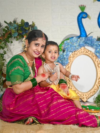 A beautiful mother and son portrait during a Janmashtami shoot, capturing the love of Yashoda for her Krishna.