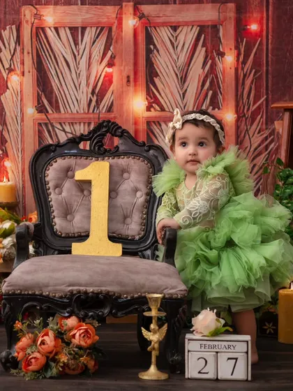 Standing tall at one. This vintage-themed first birthday photo is both classic and charming, marking a very special milestone.
