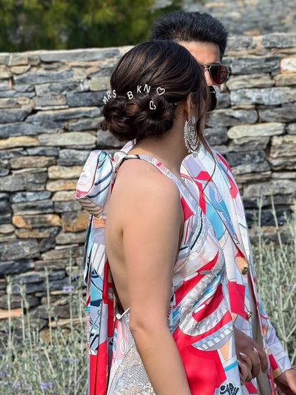 Another view of the custom "MRS" clips, showcasing a fun and modern way to personalize your bridal hairstyle.