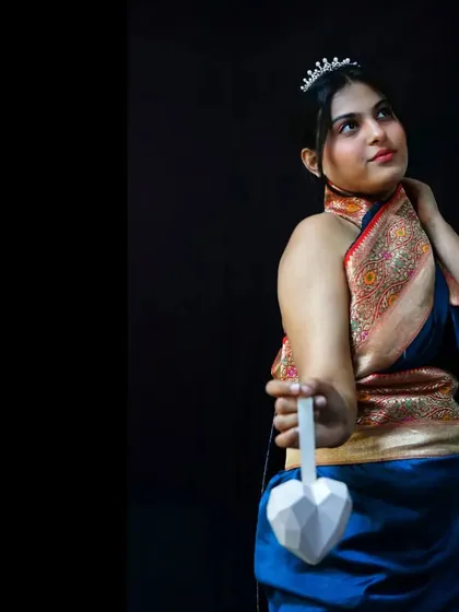 Here you can see the full silhouette of the modern saree drape against a simple black backdrop. I added a delicate tiara to give this traditional fabric a touch of regal, contemporary elegance.
