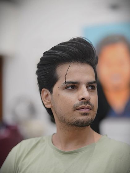 A great profile shot of this classic men's haircut. The styling gives it great volume and shape.