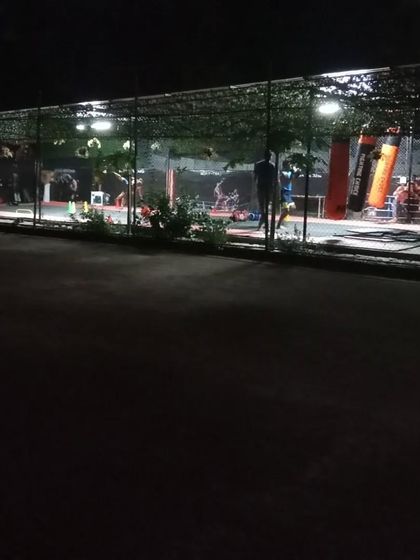 Our Sector 141 club in Noida seen from the outside at night. The lights are always on, creating a welcoming and high-energy vibe for our members.