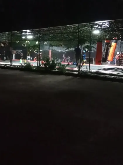 The outdoor training area at our Sector 141 club at night. The space is well-lit and perfect for evening sessions, offering a great atmosphere to train in.