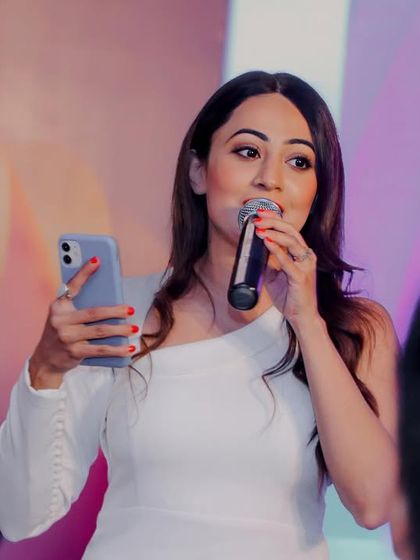 Using my phone for an interactive polling session during a tech summit. I incorporate modern technology to make corporate events more dynamic and engaging.