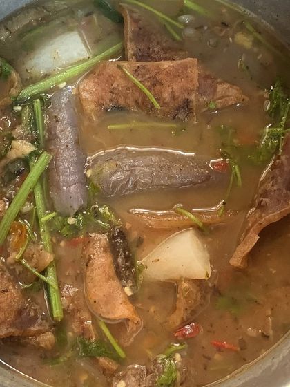 A full pot of the buff skin curry, ready to be served.