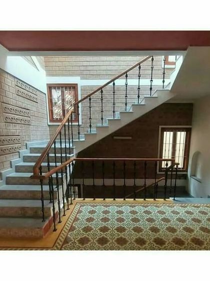 A multi-level staircase with patterned floor tiles, creating interesting visual connections between floors.