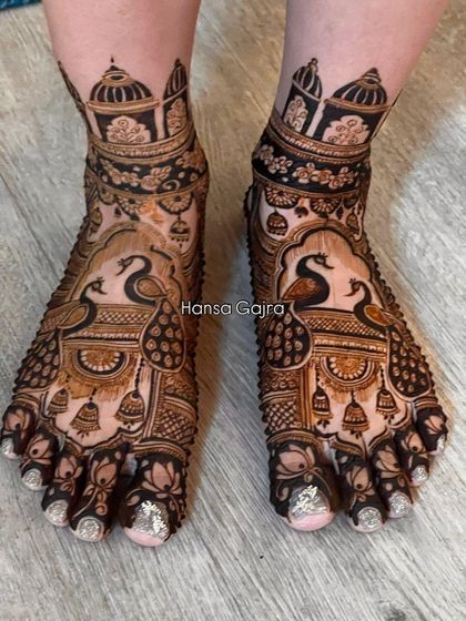 A majestic leg design featuring peacocks sitting atop architectural pillars. The intricate patterns and bold motifs create a look that is both traditional and powerful.