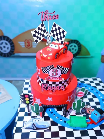 A fantastic 'Cars' themed birthday cake, complete with Lightning McQueen and a racetrack. We can help coordinate every detail, right down to the cake.