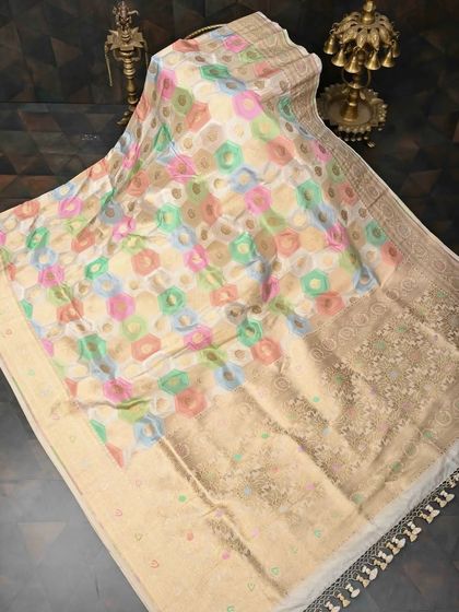 A lovely saree with a pastel-colored geometric print, reminiscent of modern Ikkat designs. The soft colors and intricate pattern make it a chic and contemporary choice.