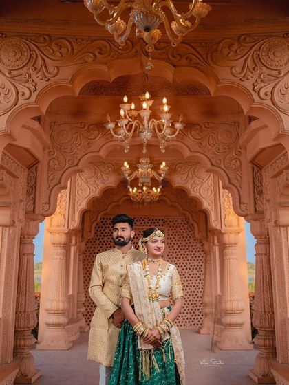 Another beautiful portrait framed by the palace arches and chandeliers. This composition draws the eye to the couple while still showcasing the magnificent setting of their pre-wedding shoot.