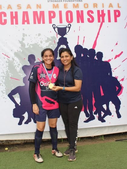 A player from our girls' team recognized for her excellent performance during the tournament.