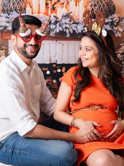 A fun and festive Christmas-themed maternity shoot. The holidays are a wonderful time to celebrate your growing family.