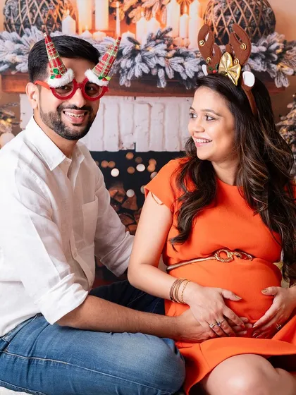 A fun and festive Christmas-themed maternity shoot. The holidays are a wonderful time to celebrate your growing family.