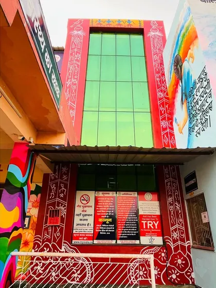 Another angle of the Ratu, Jharkhand project. This view shows the entrance, where traditional Warli art elements are mixed with modern, colorful murals to create a welcoming and unique facade.
