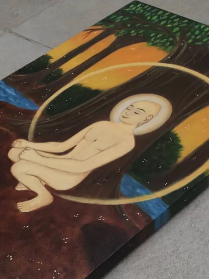A detailed side view of the Mahavir Swami painting, showing the texture of the canvas and the subtle color transitions in the background.