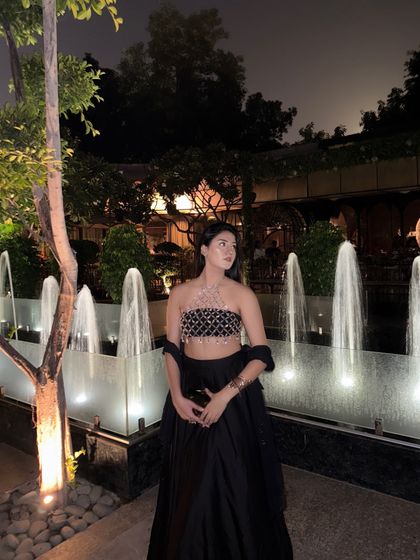 Posing by the fountains, the crystal top sparkles, making it a perfect outfit for a Diwali party or a sangeet night.