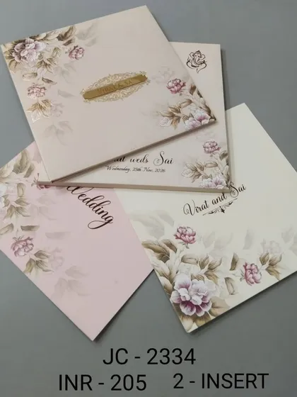 This invitation features a soft, watercolour-style floral print in shades of pink. The design is delicate and romantic, with inserts for your wedding and other events.