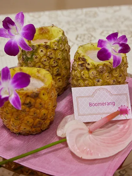 Our "Boomerang" mocktail served in hollowed-out pineapples. This creative and tropical presentation is always a conversation starter and a favourite among guests.
