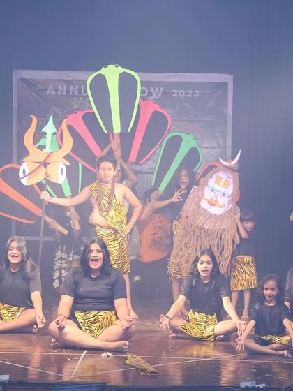This performance based on Lord Shiva's stories uses creative props and costumes to represent different elements of the mythology, like the Nandi bull and the Trishul.
