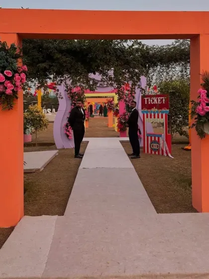 The entrance to the game night event in Lonavala. A bright orange arch and a ticket booth prop immediately set a fun and playful tone for the celebration.