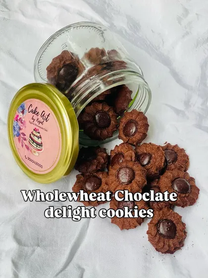 These are my wholewheat chocolate delight cookies. I make them in small batches to ensure they are fresh and crisp, with a rich chocolate button in the center.