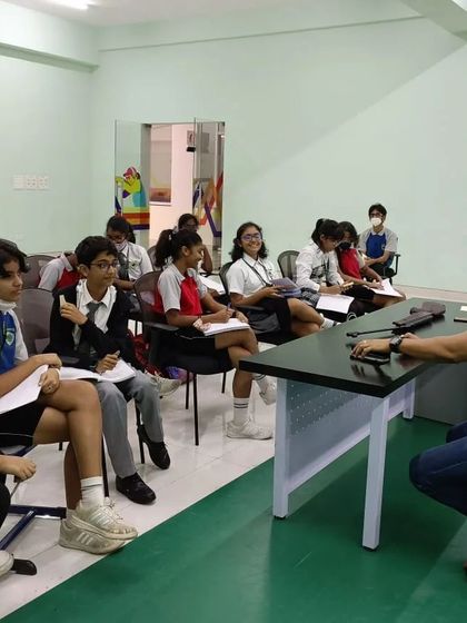 Our founder, Prakash Nanjappa, engages with students in an interactive classroom setting. These sessions provide invaluable insights into the mindset of a champion.