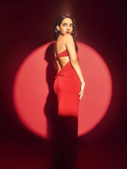 This shot of Anushka Sen for the Elle List Awards captures pure Hollywood glamour. I styled her in a striking red backless gown, using a single spotlight to create a dramatic, cinematic feel that highlights the dress's silhouette and her confident pose.
