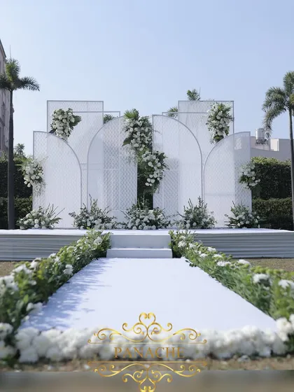 The view down the aisle towards the beautiful white-on-white stage.