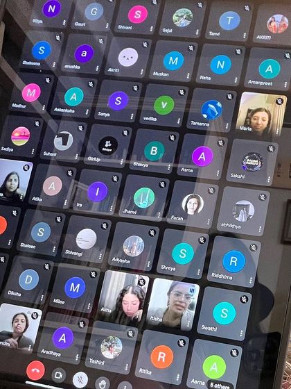 The virtual grid of faces from the Girl Up discussion. Each person present is part of the change, contributing to a more equitable future for women in all fields.