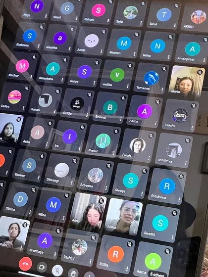 The virtual grid of faces from the Girl Up discussion. Each person present is part of the change, contributing to a more equitable future for women in all fields.