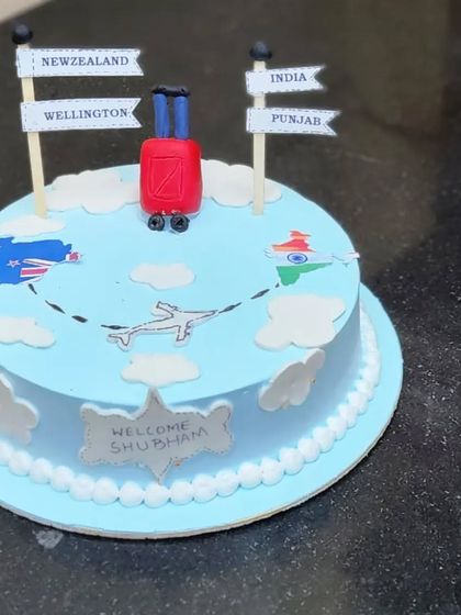 A farewell cake for someone moving from India to New Zealand. We love creating cakes that tell a personal story.