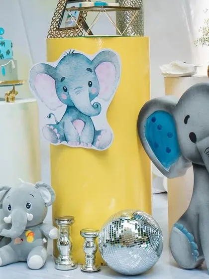 A detail shot of the elephant-themed decor, showing a large prop alongside a smaller plush toy and other decorative elements.