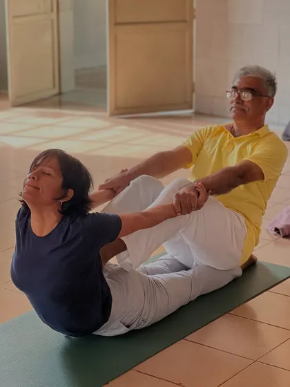 The joy of practice is evident as students support each other in partner asanas. This builds a strong sense of sangha, or community, during the intensive training course.