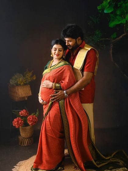 A loving embrace from behind. This pose beautifully showcases the baby bump while highlighting the supportive bond of the couple.